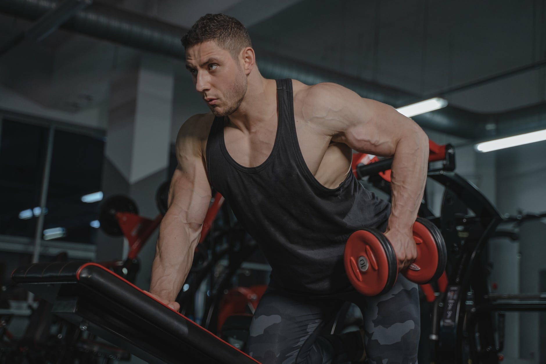 a man lifting a dumbbell