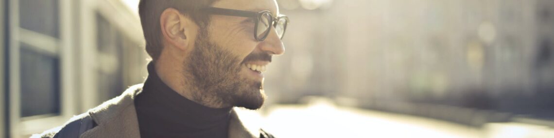 shallow focus photography of man wearing eyeglasses